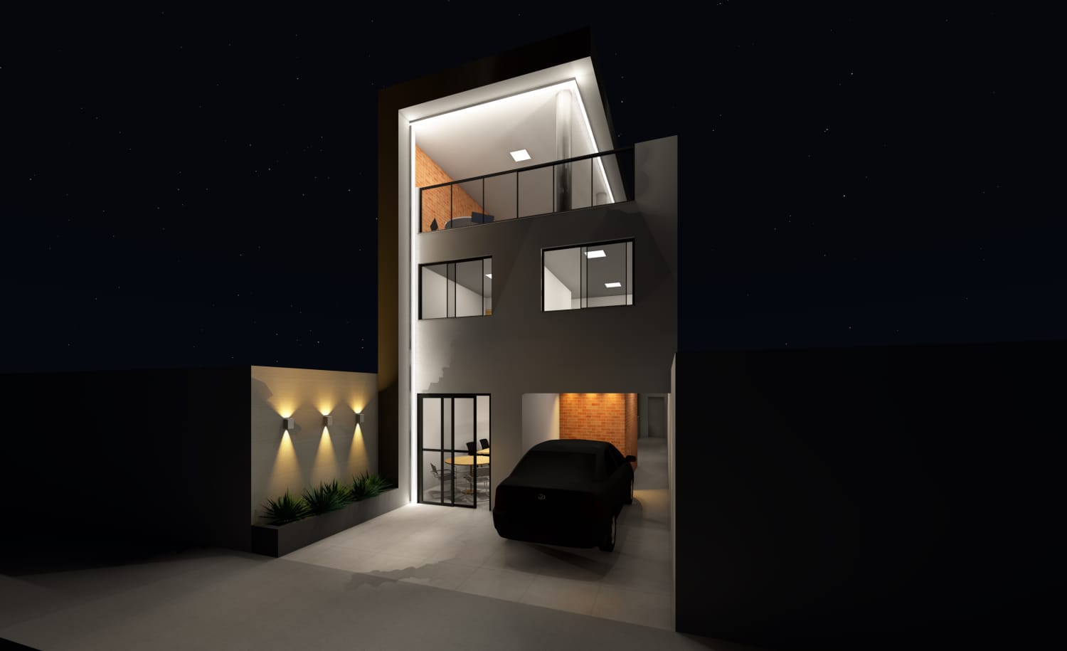 Fachada do Núcleo Seu Lugar iluminada à noite, com salas e terraço